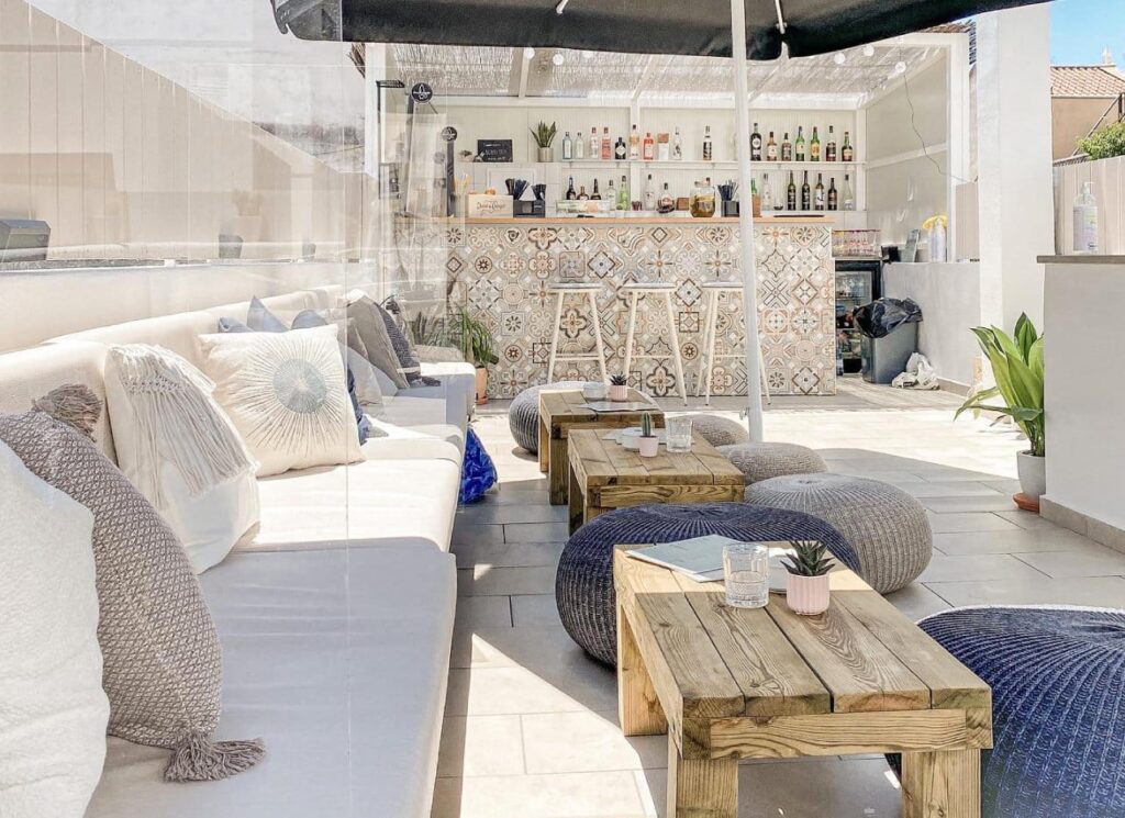 Comfortable boho rooftop with lounges and cushions